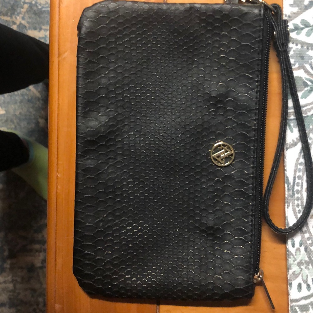 Black and gold wristlet with card slots inside